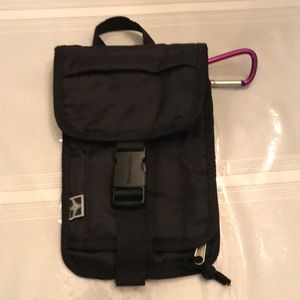 Black nylon Eastport travel wallet with  numerous zipper/velcro pocket/slips.